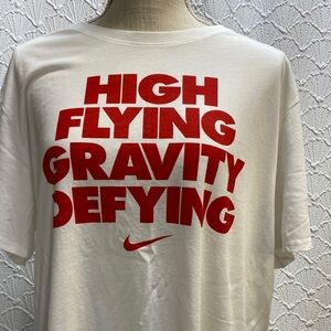 The Nike Tee size XL DriFit White Tee with Bold Red Text graphics basketball